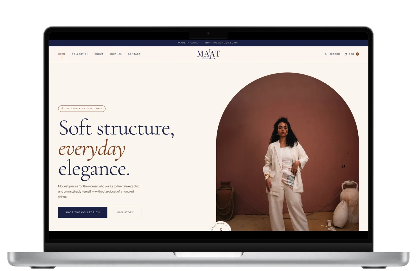 Ma&rsquo;at fashion e-commerce website on a laptop